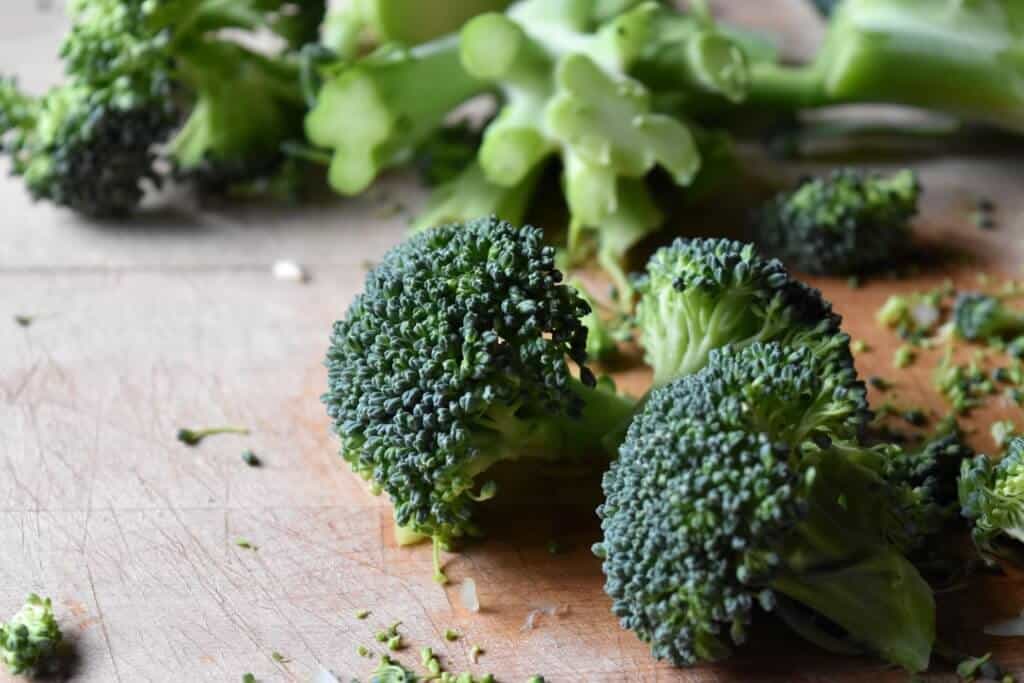 Fresh broccoli on a wooden board.