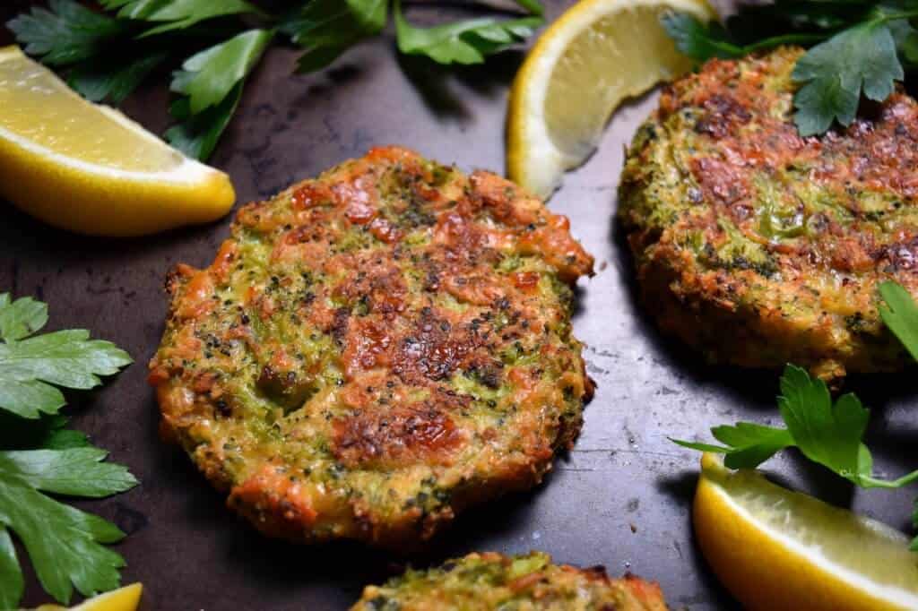 A close up photo of baked broccoli patties.