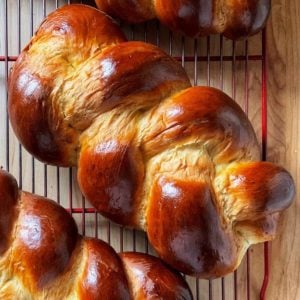 Braided Easter loaves on a cooling rack.
