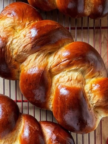 Braided Easter loaves on a cooling rack.