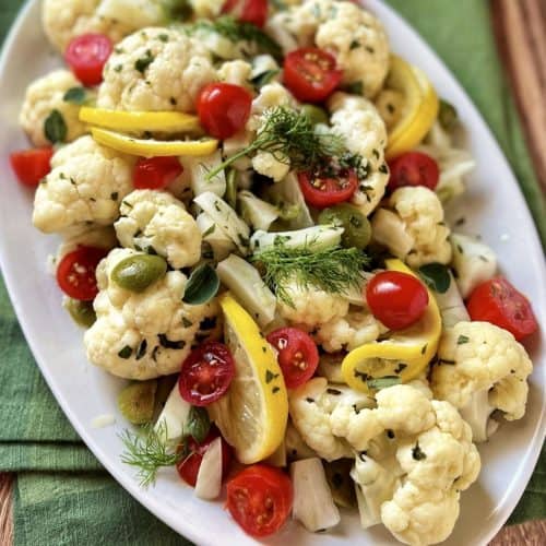Cauliflower fennel salad on a white serving platter.
