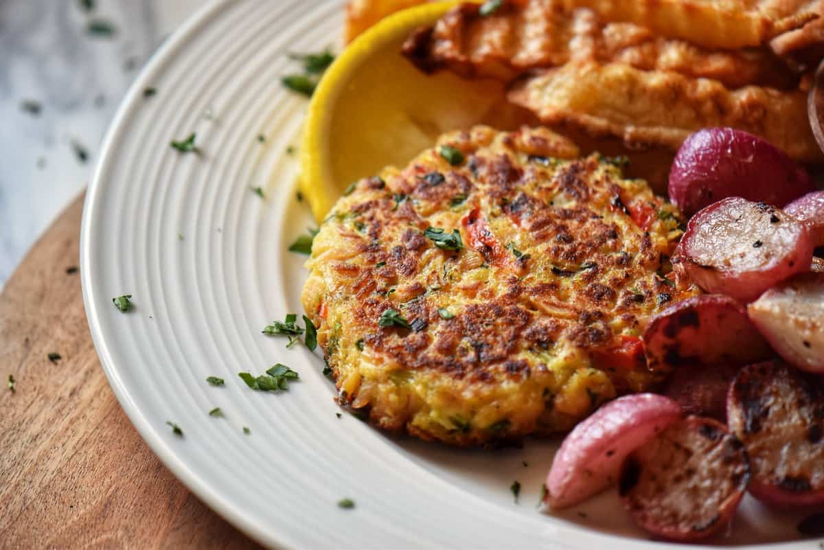 Beautifully presented tuna patties with lemon wedges. 