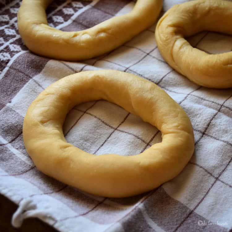 Taralli resting on a tea towel.