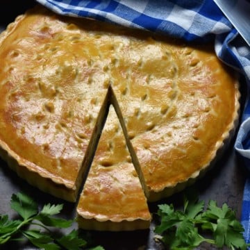 Italian pizza rustica with a slice cut.