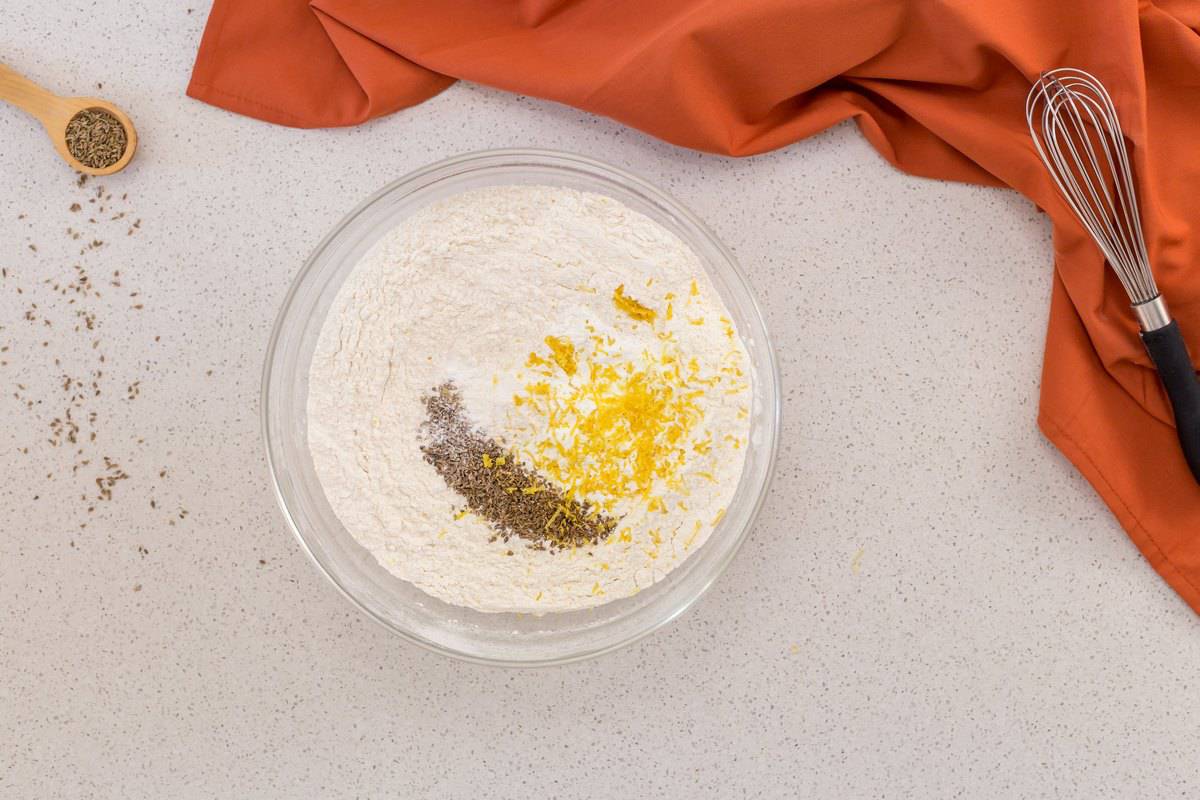 An overhead shot of the dry ingredients needed to make anise cookies.