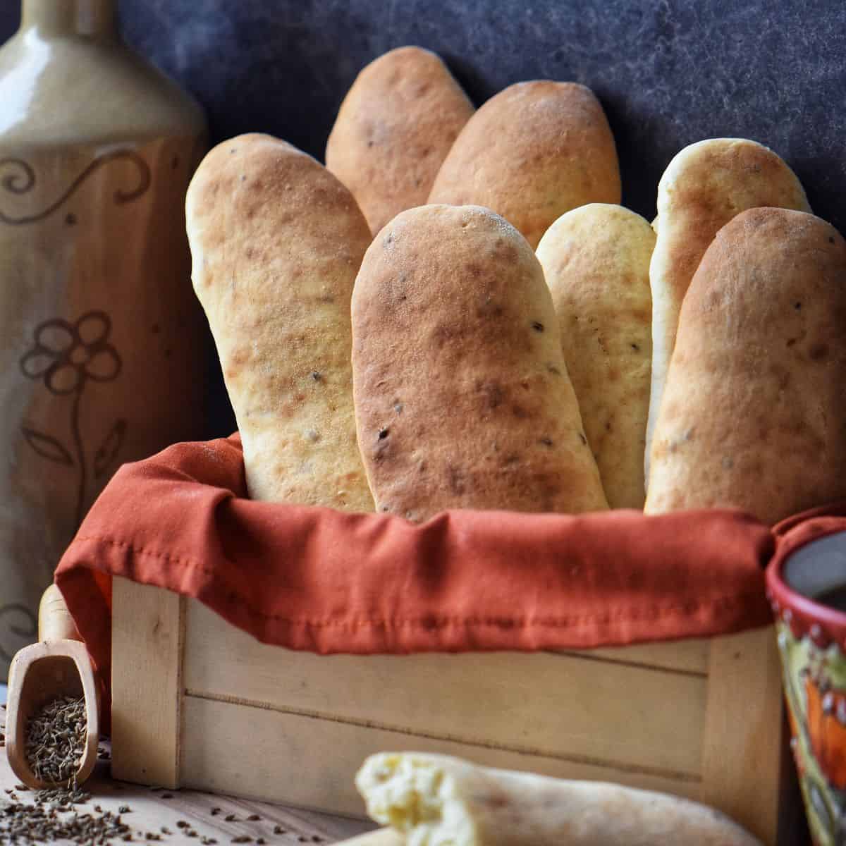 Anise cookies next to a cup of coffee.