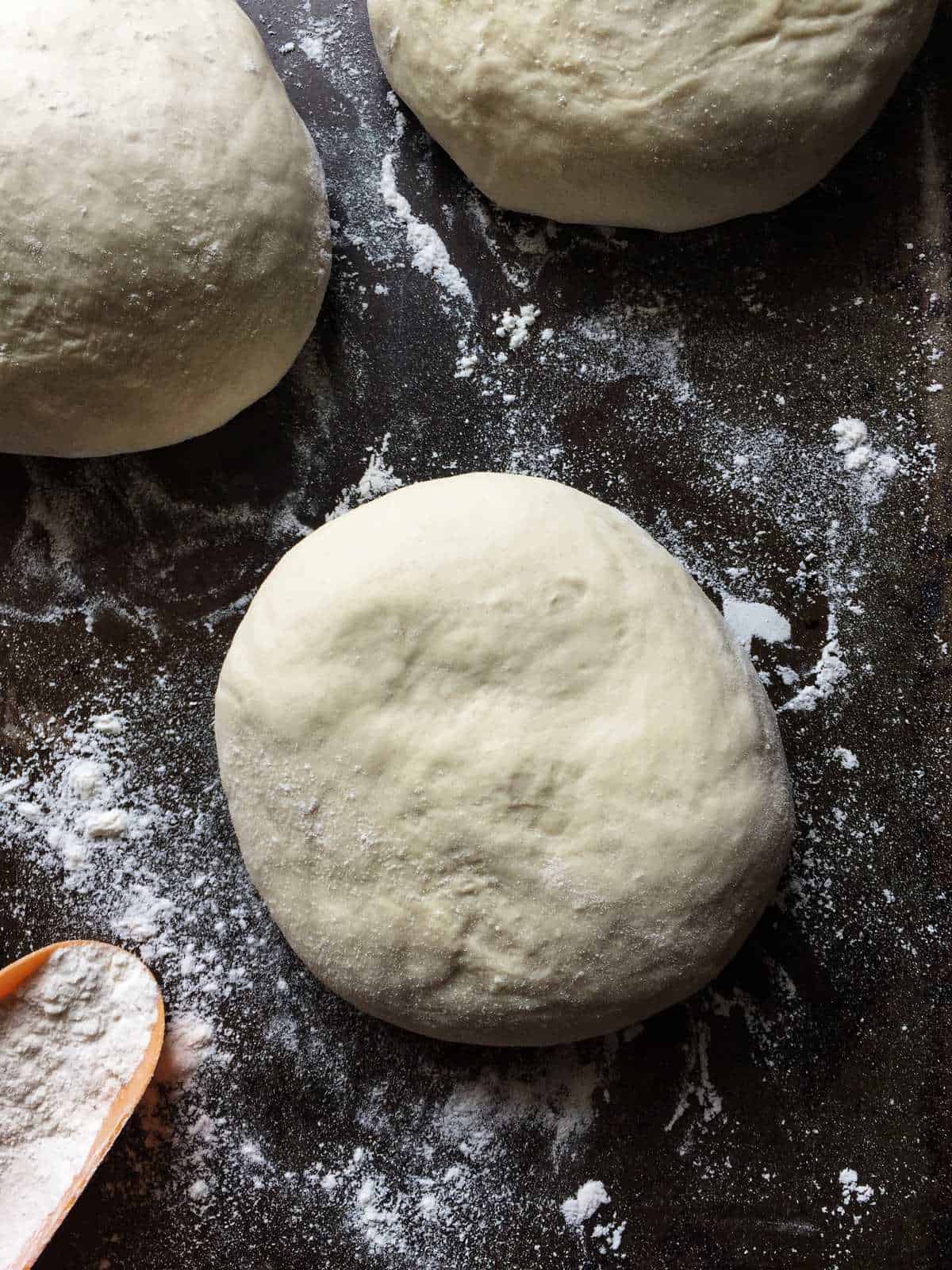 Balls of pizza dough ready to be stretched.