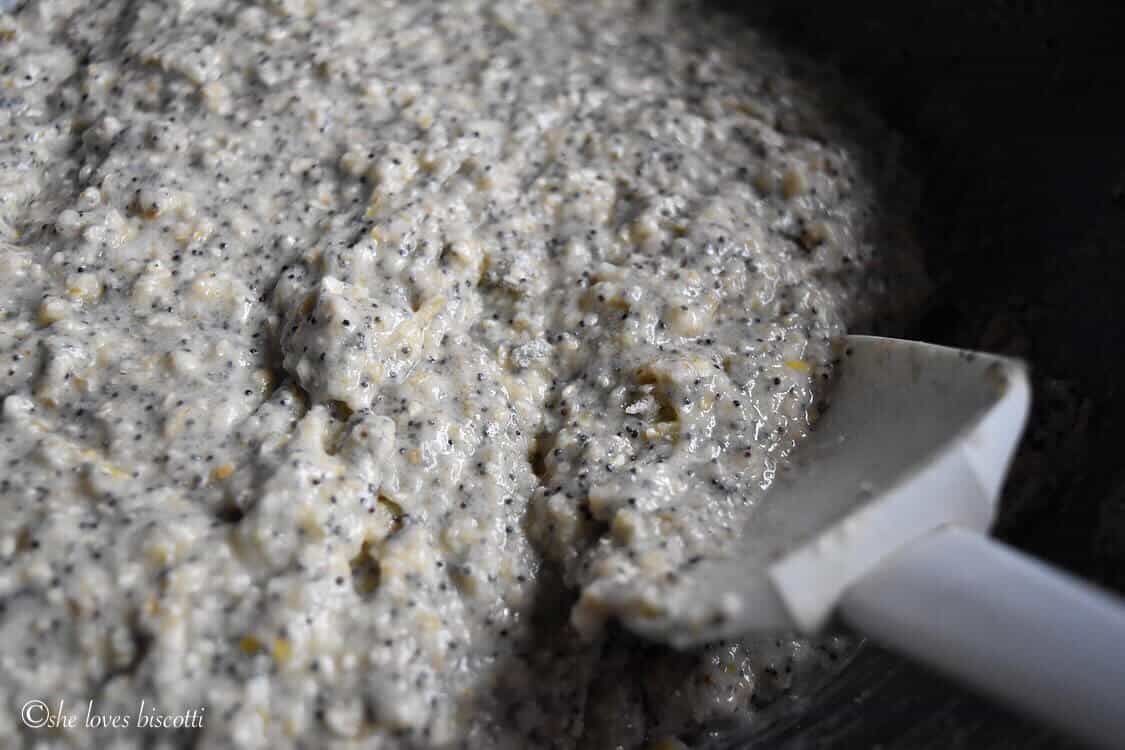 Poppy seed muffin batter in a bowl.