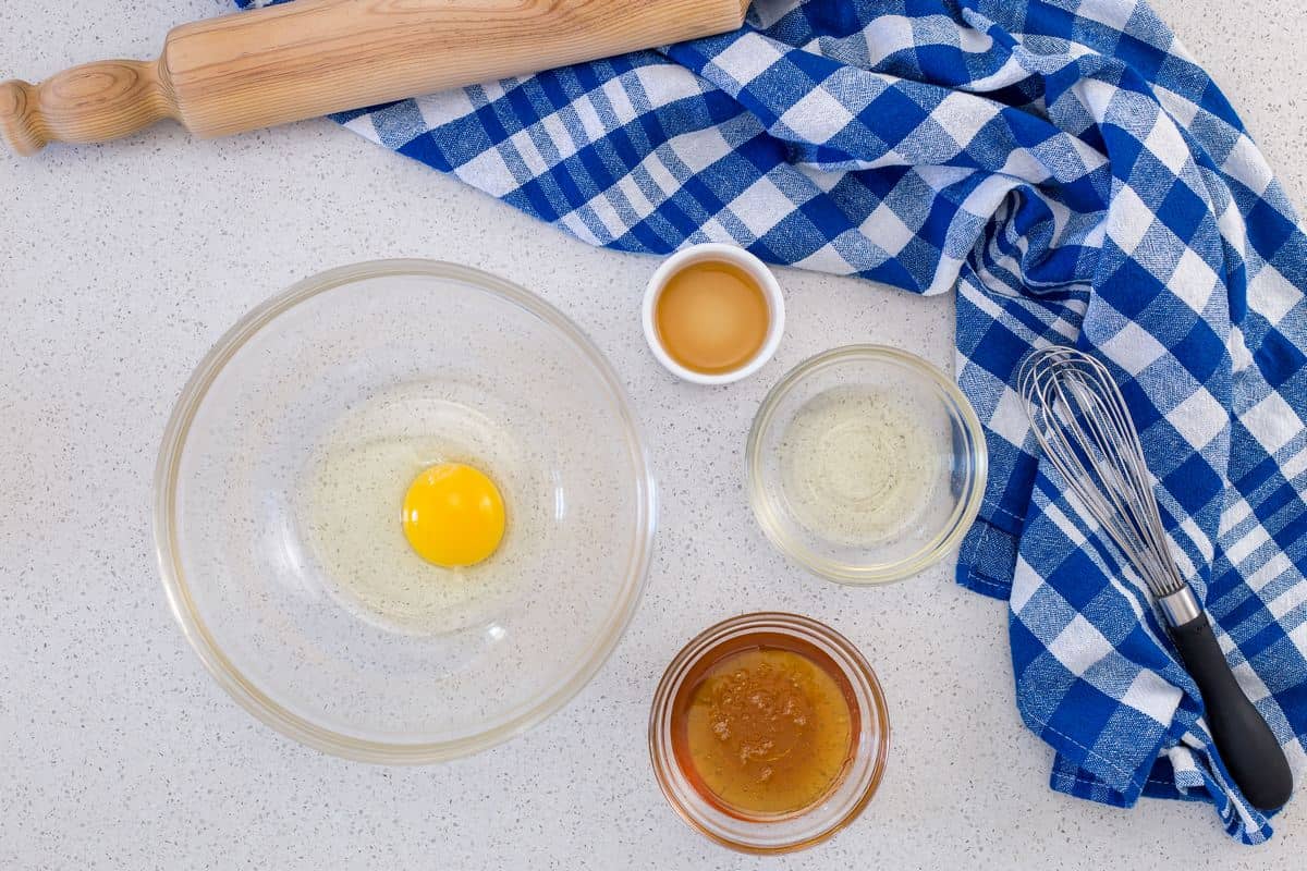 An overhead shot of the the liquid ingredients needed to make theses honey cookies.