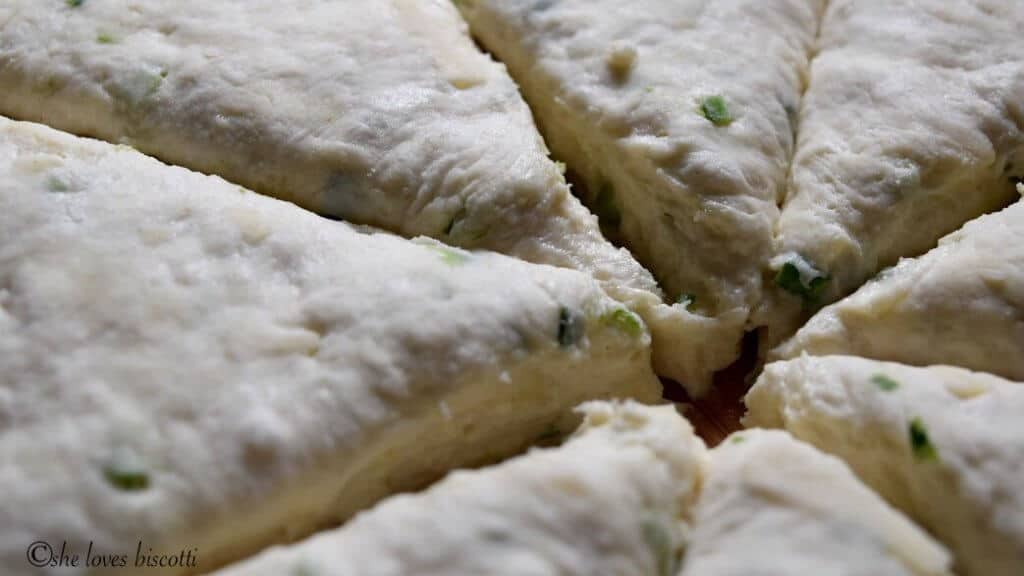 Buttermilk Cheese Biscuits that have been cut into wedges, before being baked.