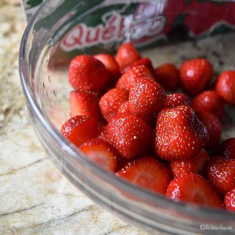 A close up of fresh strawberries in a bowl.