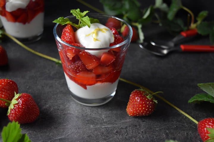 A photo of whipped ricotta parfait surrounded with fresh berries.