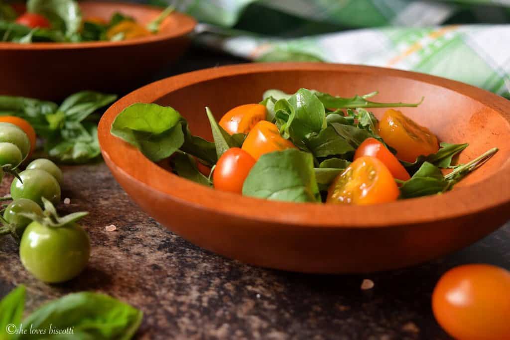 A bowl of Easy Garden Fresh Cherry Tomato Arugula Salad