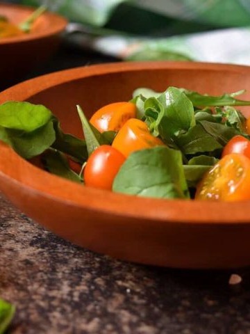 A bowl of Easy Garden Fresh Cherry Tomato Arugula Salad