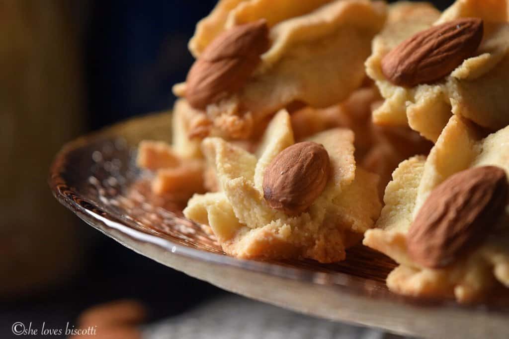 A close up of an amaretti decorated with a whole almond.