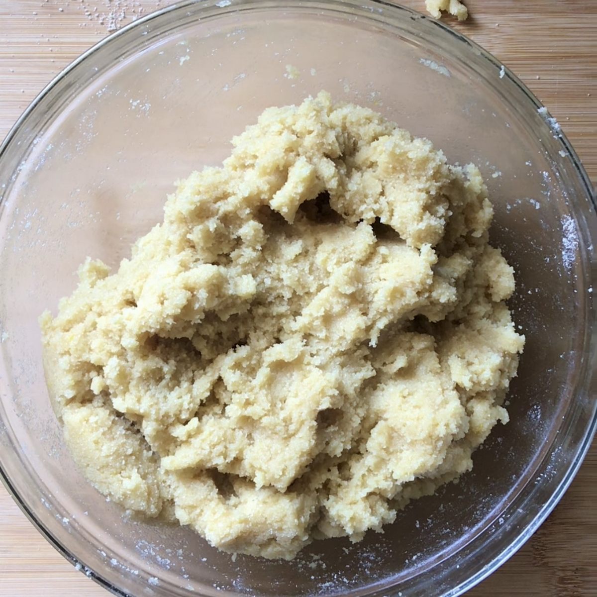 The raw dough to make gluten-free Italian cookies in a large bowl.