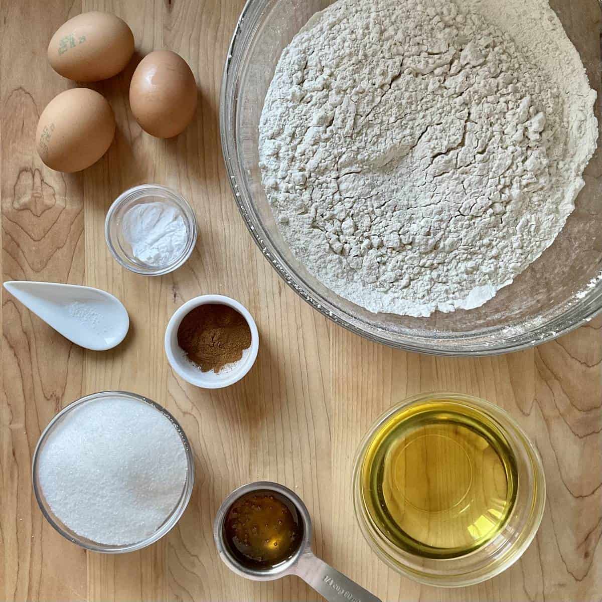 Ingredients to make honey cookies on a wooden board.