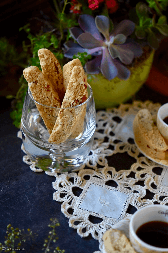 A few Almond Biscotti standing upright in a glass.