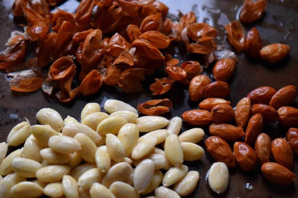 Blanched almonds with and without their skins.