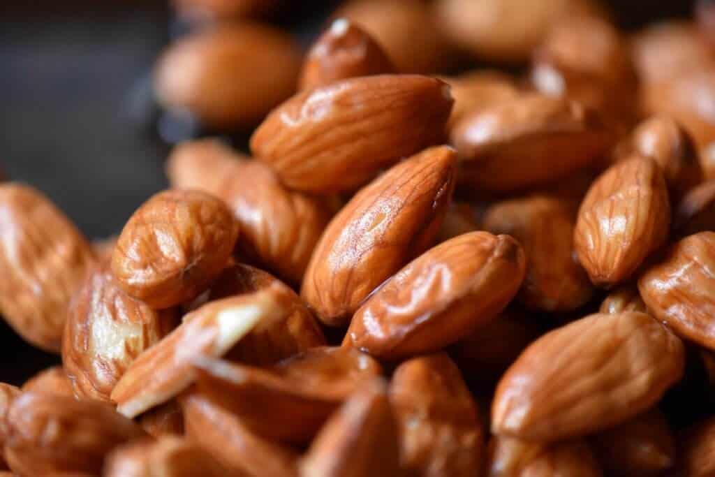 Close up of the wrinkled skins of almonds.