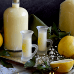 A bottle and a few glasses of limoncello are displayed. for this Crema di Limoncello di Vittoria