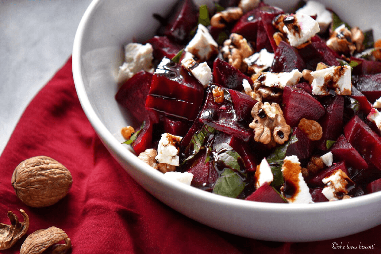 Ricotta Salata Roasted Beet Fall Salad shown in a white bowl.