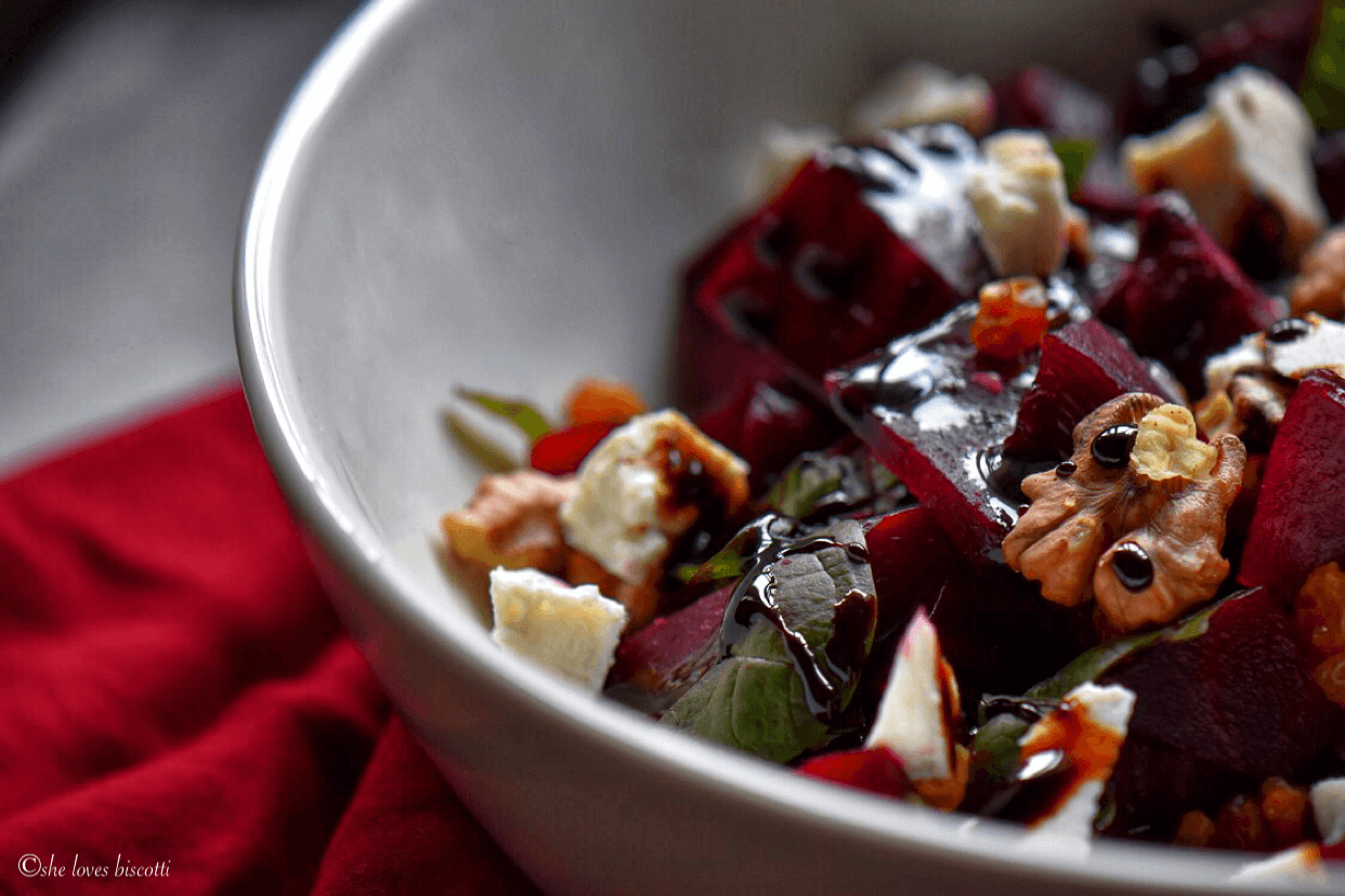 Close up of the beet salad with a focus on the balsamic reduction drizzle.