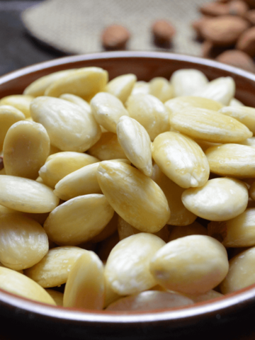 Round dish of blanched almonds.