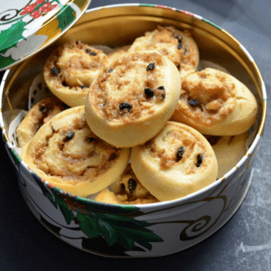 A cookie tin of the pets de soeur cookies is shown.