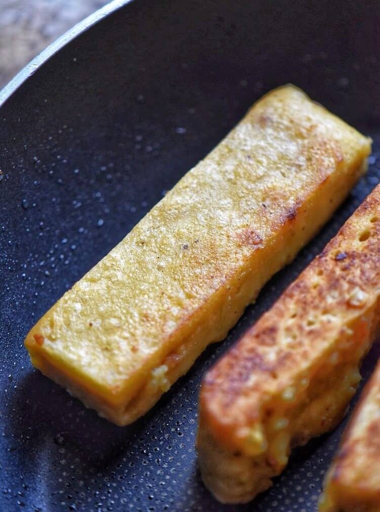 Sicilian panelle being pan fried.