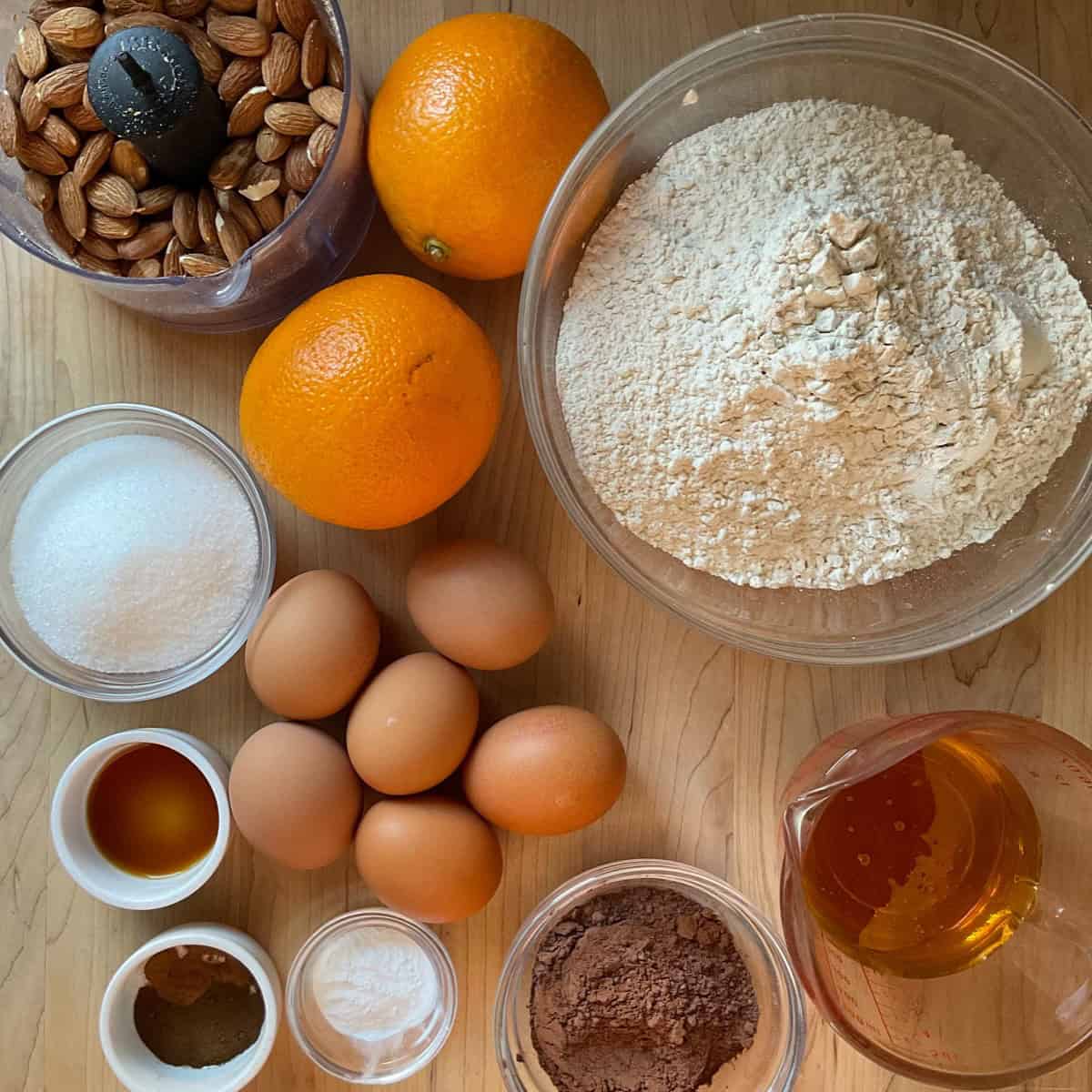 Ingredients to make mostaccioli on a wooden board.
