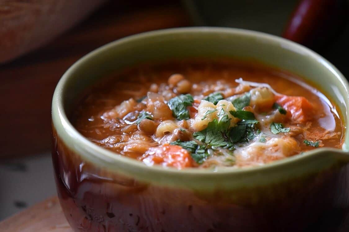 A close up of a bowl pasta with lentils.