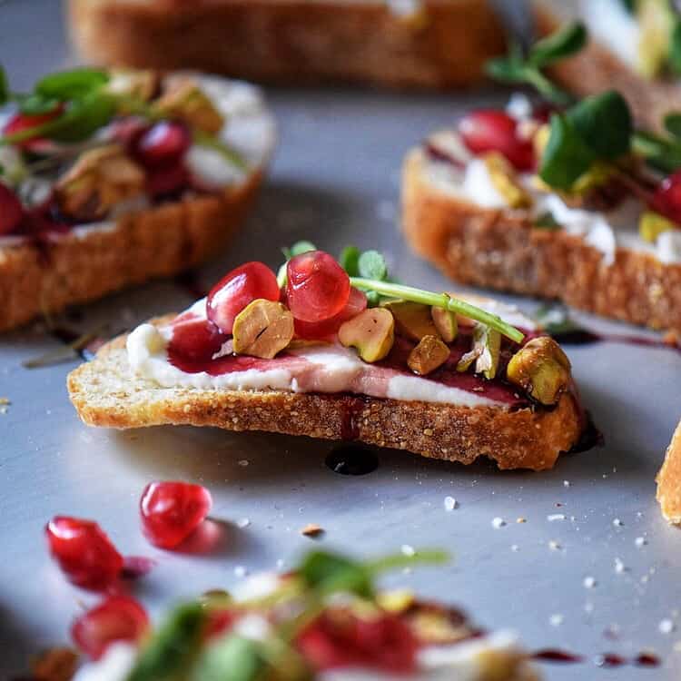 The completed Whipped Ricotta Pomegranate Crostini Recipe.