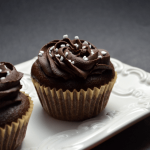 Chocolate Surprise Cupcakes on a white serving tray.