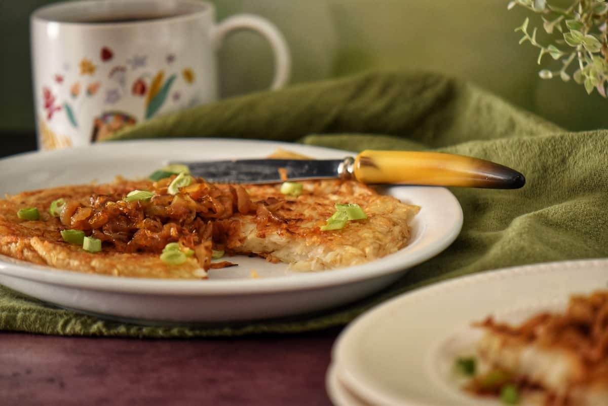 A close up of the interior of a crispy hash brown.