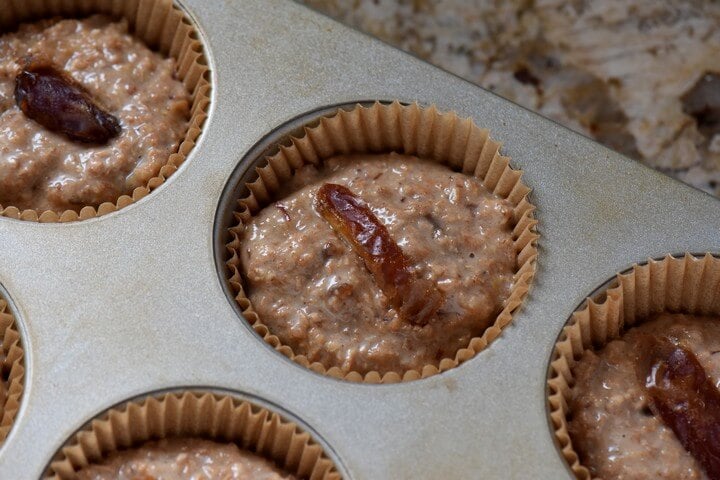 The bran muffin batter is shown in the individual muffin cups.