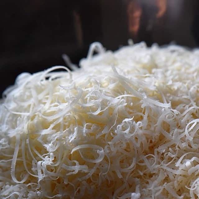 A close up of the texture of the grated cheeses used for the Italian Easter bread.