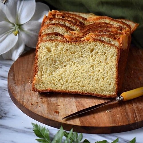 A loaf of the Italian Easter Bread is sliced to reveal the wonderful airy texture of the bread.