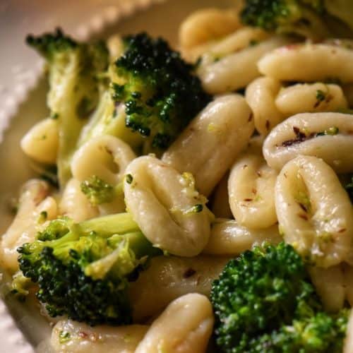 Sauteed broccoli and cavatelli pasta garnished with grated cheese.