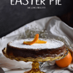 Rice ricotta Easter pie set on a high cake stand.