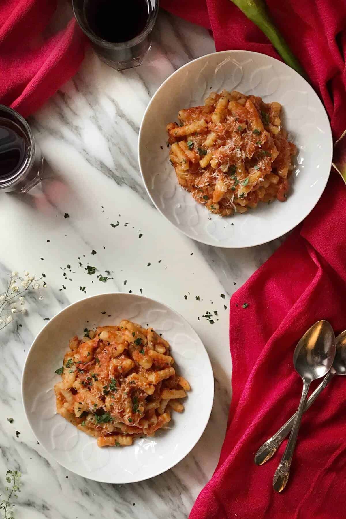 Two plates of Roasted Red Pepper Sauce & Cavatelli.