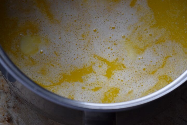 The initial preparation of the cozonac dough involves heating the milk,sugar and butter together.