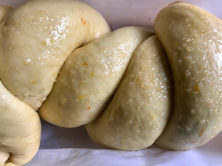 A proofed braided cozonac loaf, ready to go in the oven.