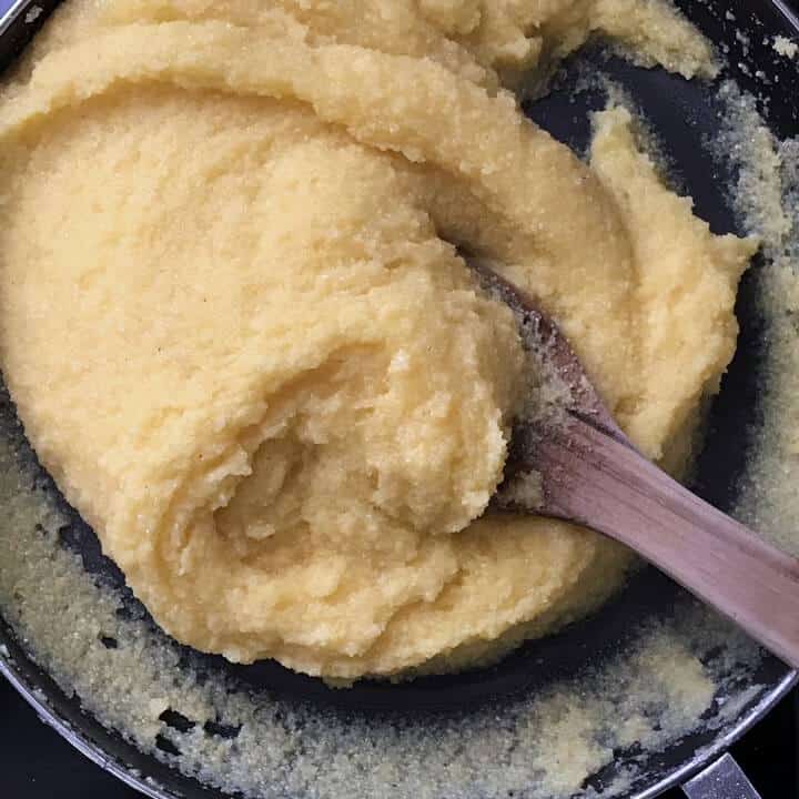 The thick texture of the cooked stove top corn meal (destined to become a polenta crust) is pictured.