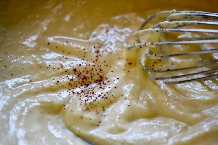 A sprinkle of nutmeg needs to be whisked into the ricotta mixture.