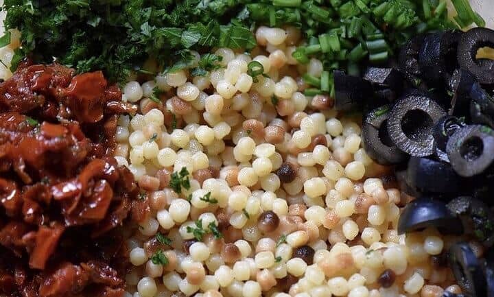 A close up shot at some of the ingredients used to make the lentil pasta salad.