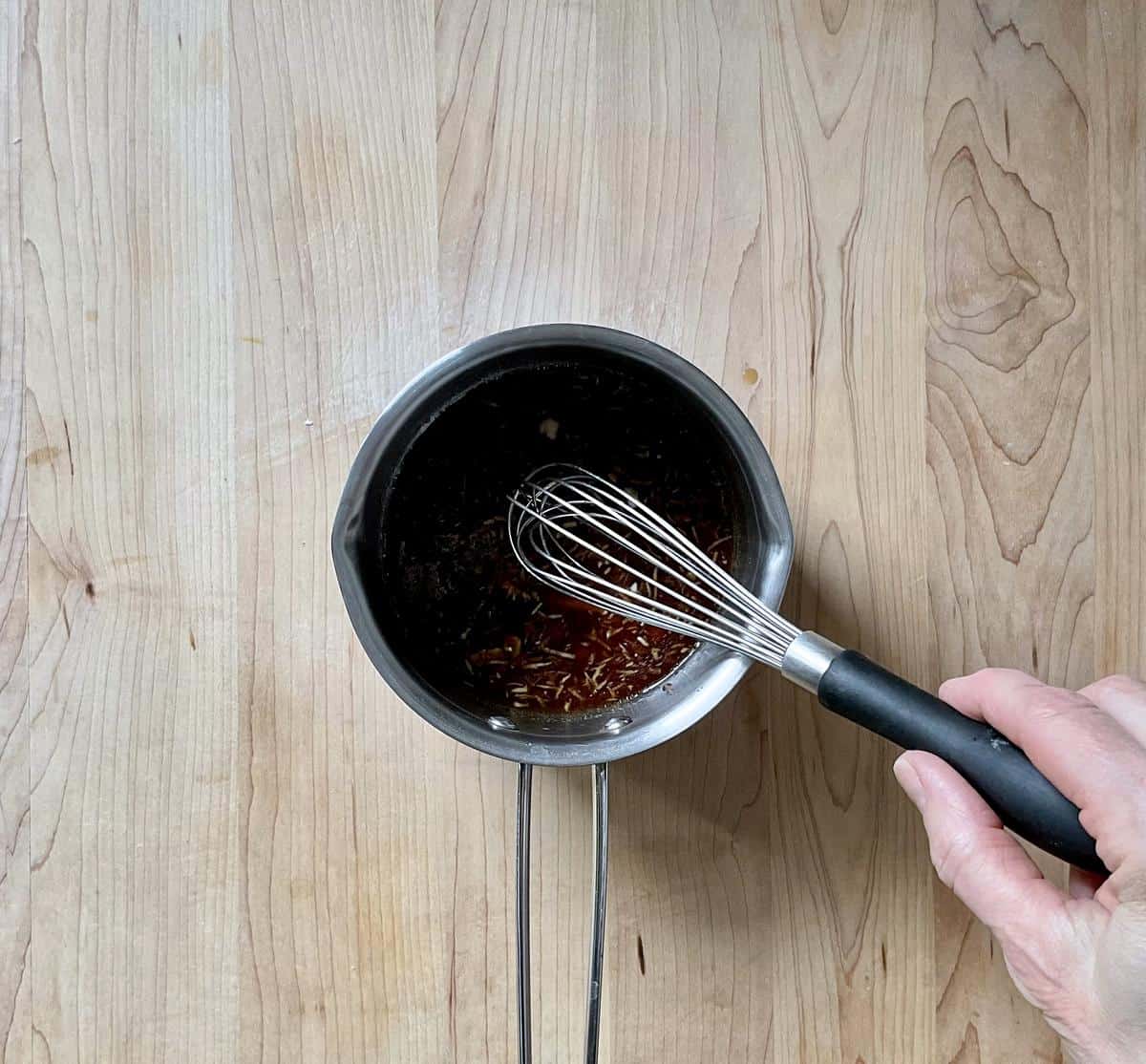 The maple glaze in a small saucepan.