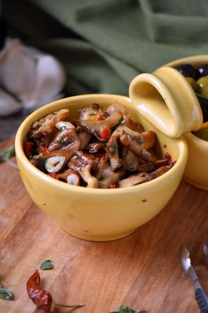 Marinated mushrooms ready to be served as part of the antipasti.