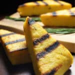 A close up shot of the BBQ markings on a triangular piece of grilled polenta.