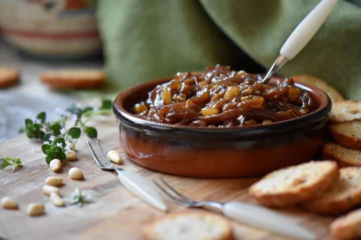 Eggplant caponata in a small round ceramic dish.